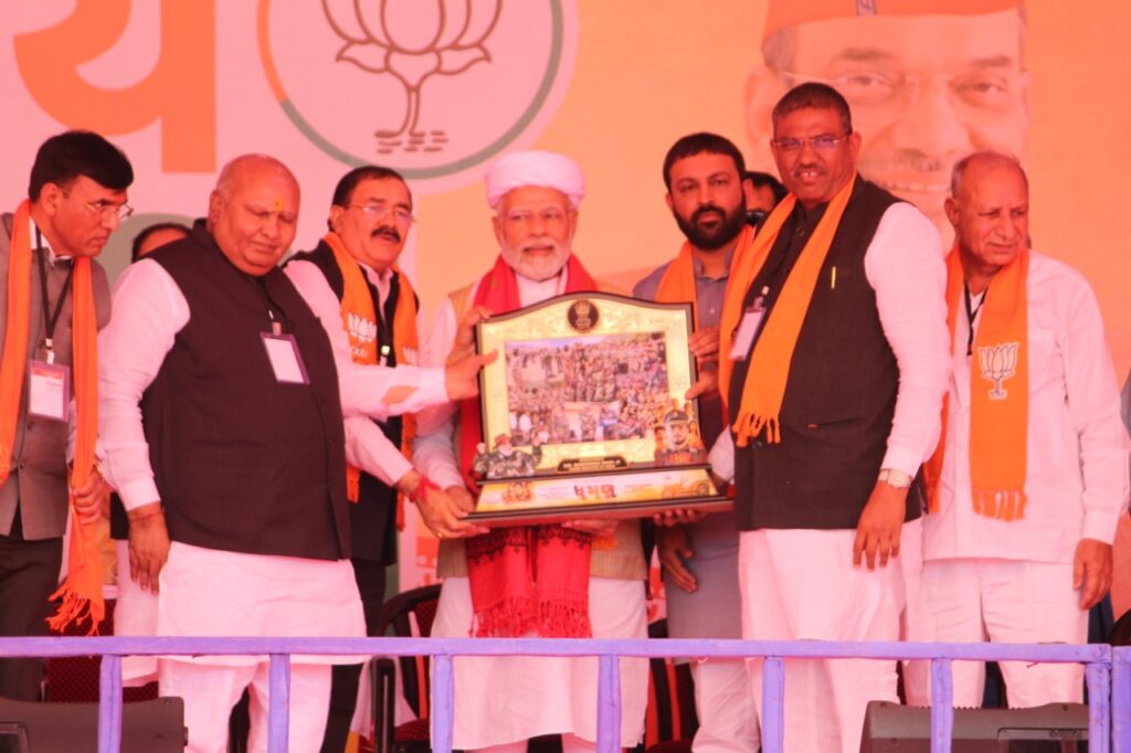 Upcoming Dhaman Gujarati movie's producer Bhupat Bodar presents memento to PM Modi behalf of his Dhaman team 